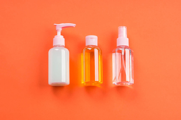 Generic beauty products on orange coral - 写真・画像