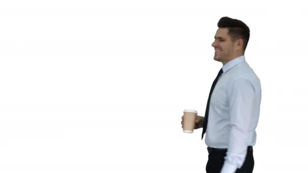Businessman walking with take away coffee and paper bag with lunch on white background. - Imágenes, Vídeo