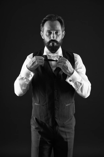 Classy style. Man bearded guy wear white shirt and classic vest outfit. Formal outfit. Elegant outfit mature man. Take good care of your silhouette. How to dress for your age. Elegancy and male style - 写真・画像