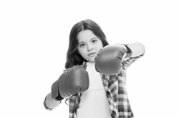 Girl power concept. Kid boxing gloves isolated white. Child boxer defend herself. Sport activity. Boxing practice. Feminist movement. Self defend strategy. Attack and defend skills. Defend yourself - Foto, Imagen