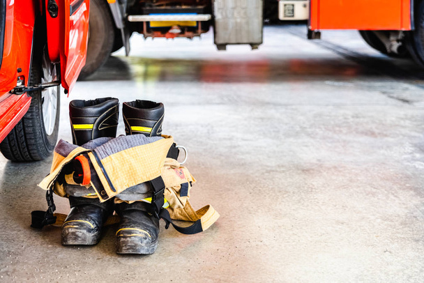 Flame retardant fireman's boots and pants ready to be used in ca - Photo, Image