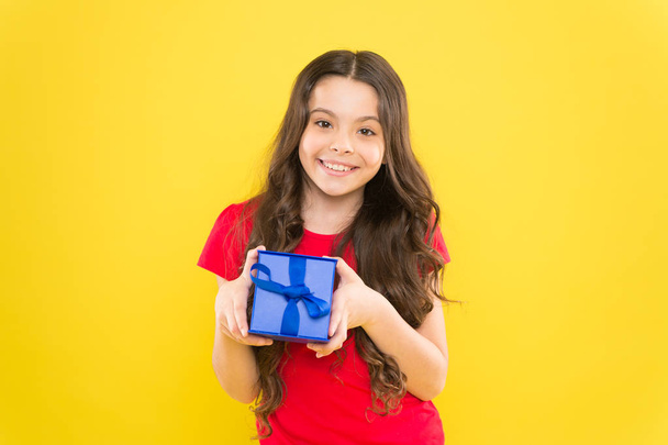 Feeling grateful for good gift. Surprise and pleasant present box. Child happy hold gift box. Kid girl delighted gift. Unexpected surprise. Celebrate birthday. Kid love birthday gift. Extra bonus - Foto, Imagem