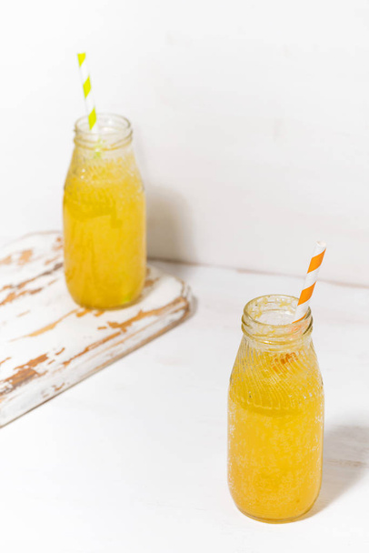 bottles of homemade citrus lemonade on a white background, verti - Foto, Imagem