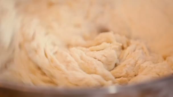 Kneading dough in a bowl - Filmati, video