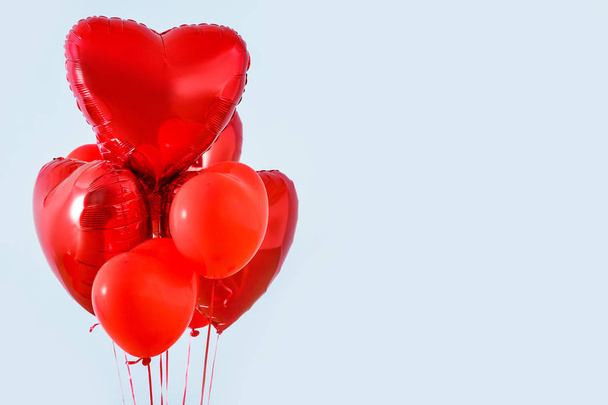 Heart shaped air balloons on grey background - Zdjęcie, obraz