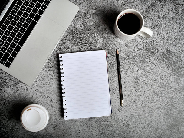 Laptop, supplies, cup of coffee. gray texture background. Coffee - Zdjęcie, obraz