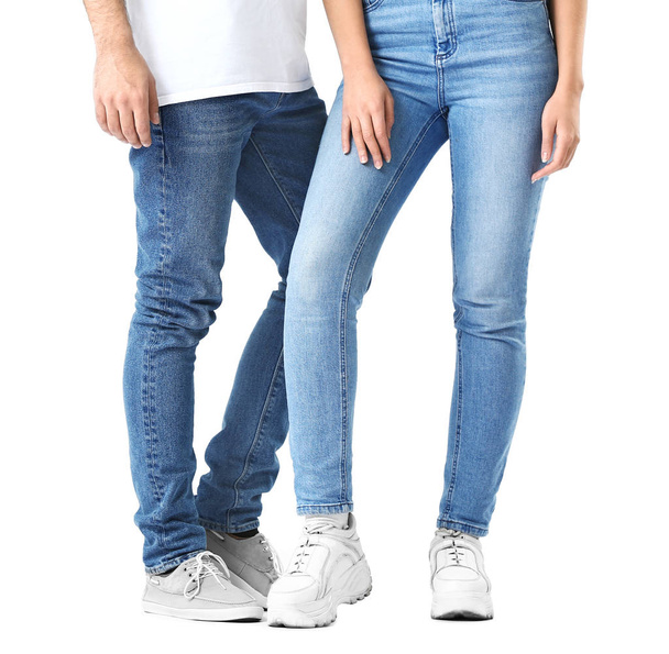 Stylish young couple in jeans on white background - Foto, afbeelding