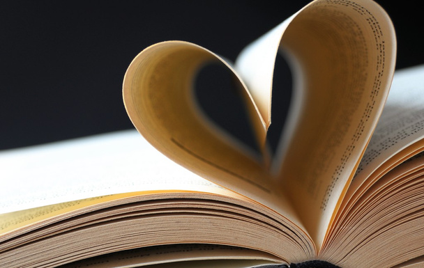 Pages of a book curved into a heart - Fotó, kép