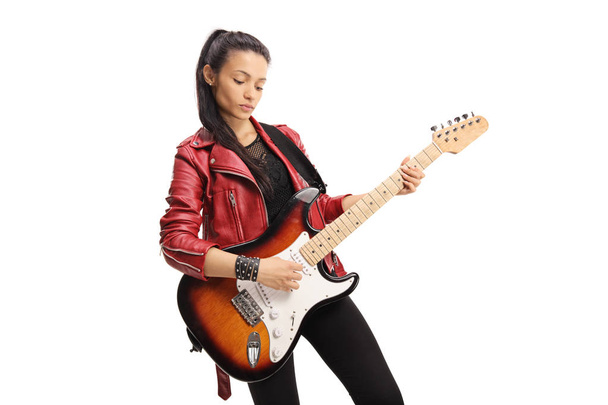 Female rock star playing a bass guitar isolated on white background - Фото, изображение