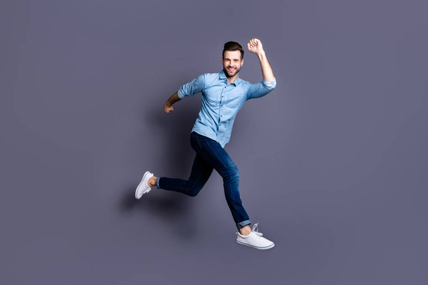 Full length body size view portrait of his he nice attractive cheerful cheery optimistic macho guy having fun time isolated over gray violet purple pastel background - Фото, изображение