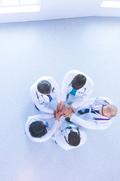 Medical team sitting and discussing at table, top view - Фото, зображення