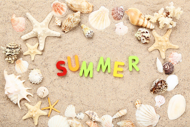 Word Summer with seashells on beach sand - 写真・画像