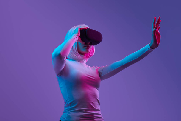 Futuristic woman interacting with virtual reality - Zdjęcie, obraz