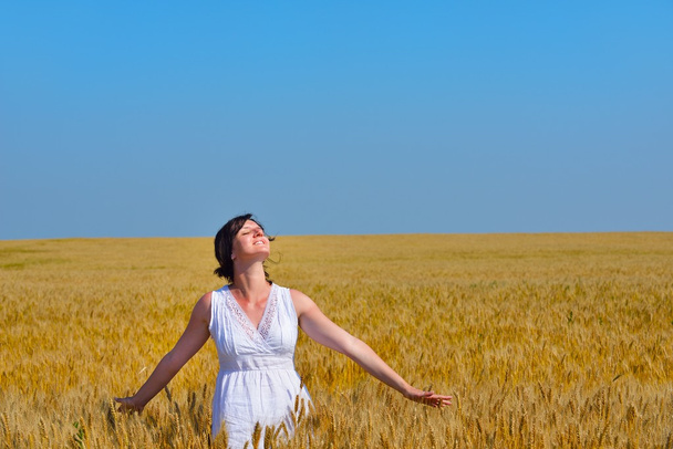 young woman in wheat field at summer - Фото, зображення