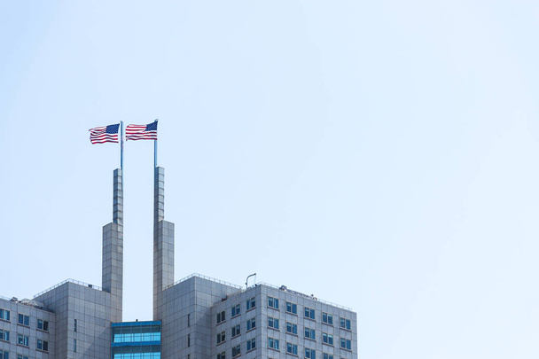 Two American flags on a top of a building. - Photo, Image