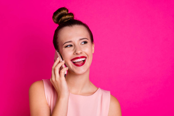 Close up photo of funny funky lovely shiny girl people person hold hand modern technology laughter dressed top-knot have dialogue friends isolated she her vibrant background - Photo, Image