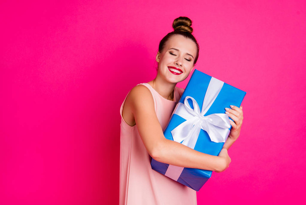 Portrait of charming lovely youth millennial have gift close eyes expect ribbon white pomade dressed dress top-knot fashionable she her isolated pink background - Foto, immagini