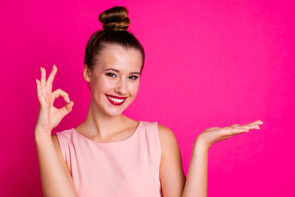 Portrait of magnificent attractive shiny youth people person toothy confident promoter adverts wear blouse fashionable top knot isolated pink colorful background - Foto, Imagem