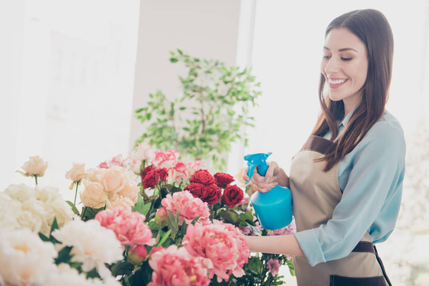 Portarit of positive cheerful satisfied content lady vendor have hobby enjoy floristry natural retail wear blue workplace shirt stylish trendy beautiful indoors - Foto, Imagen