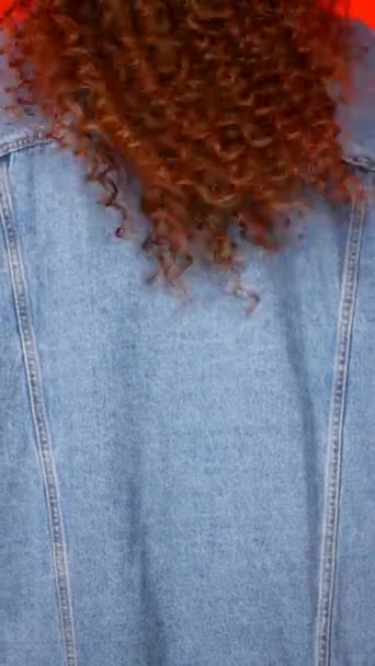 Beautiful young attractive woman with curly hair back , slow moving - Záběry, video