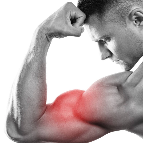 Young muscular man showing his bicep - Photo, Image