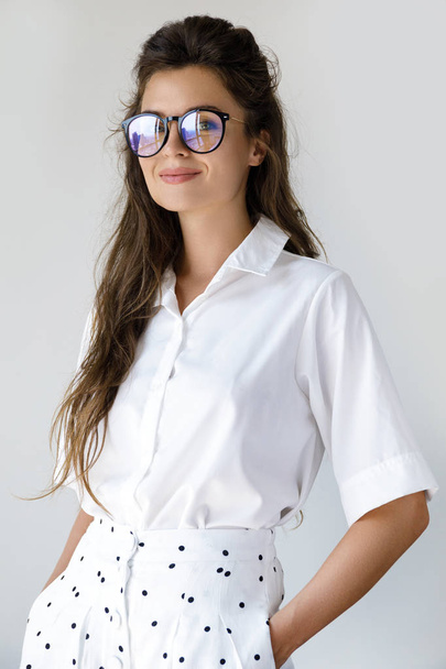 Young businesswoman wearing stylish clothes and eyeglasses - Φωτογραφία, εικόνα