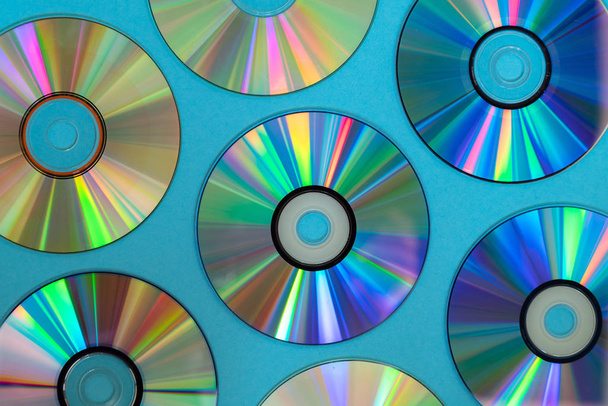 Vintage CD or DVD disk background, old circle discs used for data storage, share movies and music - Photo, Image
