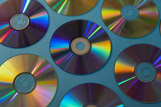 Vintage CD or DVD disk background, old circle discs used for data storage, share movies and music - Photo, Image