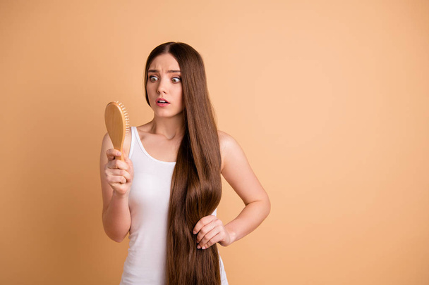 Portrait of her she nice-looking gorgeous attractive well-groomed nervous lady combing clean clear flawless effect repair hair restoration isolated over beige background - Photo, Image