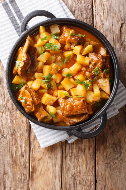 Slow cooked short beef ribs with potatoes in a spicy sauce close - Photo, Image