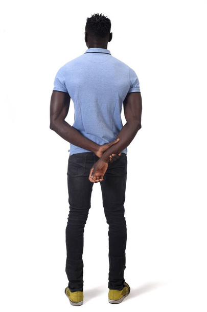 rear view of african man hands on back on white background - Foto, Bild