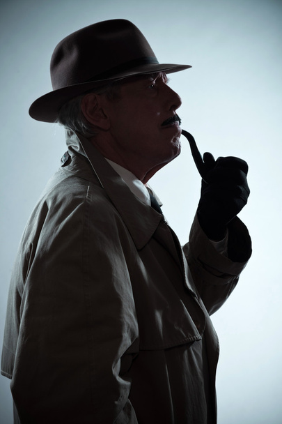Silhouette of vintage detective with mustache and hat. Smoking p - Foto, afbeelding