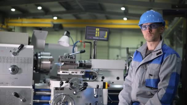 Metal Processing Worker Portrait. Worker Seating in Front of Metal Lathe. Industrial Theme - Footage, Video