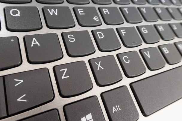 Close-up detail of a QWERTY keyboard of a laptop PC - Foto, imagen