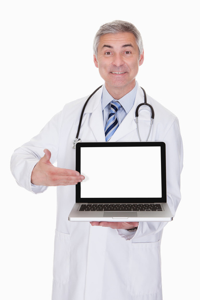 Portrait Of Male Doctor Showing Laptop - Фото, изображение