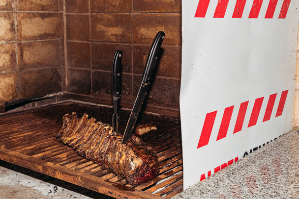 "Parrillada" Argentine barbecue make on live coal (no flame), beef "asado", bread, "Chorizo" - Photo, Image