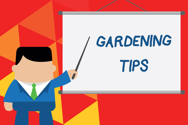 Conceptual hand writing showing Gardening Tips. Business photo text Proper Practices in growing crops Botanical Approach Businessman standing in front projector pointing project idea. - Photo, Image