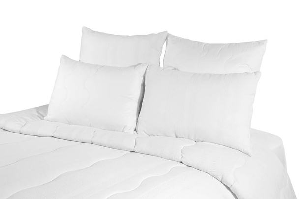 White coverlet or bedspread with four pillows isolated. White bedlinen on the bed. - Foto, afbeelding