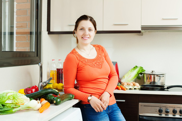 woman with vegetables in home kitchen - Foto, Imagen