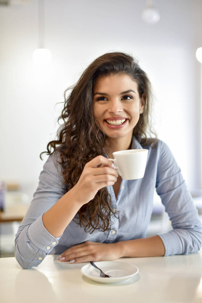 Happy woman having a coffee - Фото, изображение