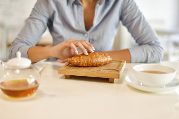 Croissant and tea for breakfast - Photo, Image