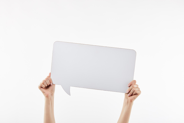 cropped view of woman with speech bubble in hands isolated on white - Fotó, kép