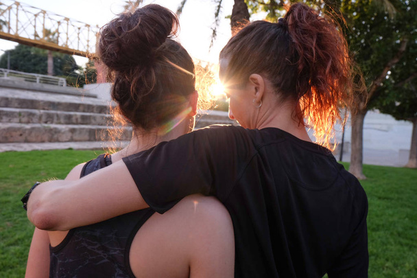 end of training, two women hugging after training - Photo, Image
