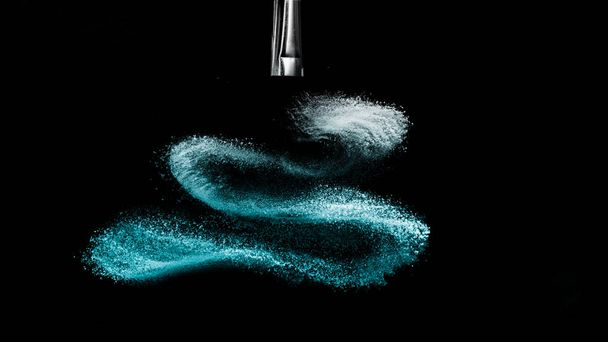 Deep ocean powder color splash and silver brush for makeup artis - Photo, Image