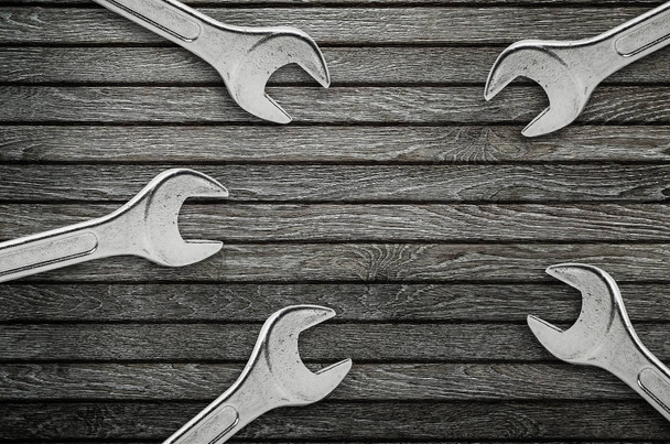 Wrenches on natural wooden background. - Φωτογραφία, εικόνα