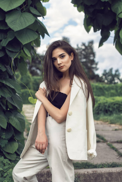 Young brunette in stylish modern clothes - Fotoğraf, Görsel