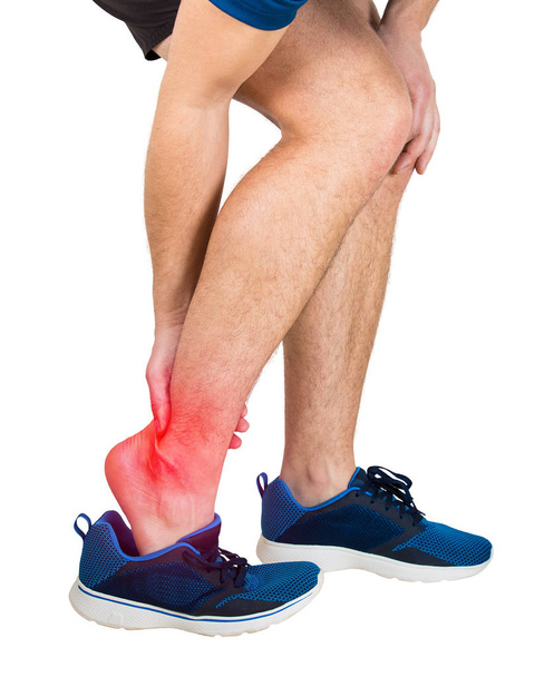 sportsman suffering ankle pain - Fotoğraf, Görsel