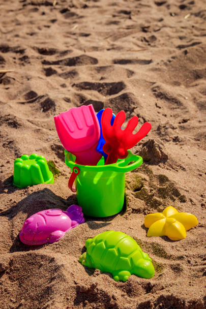 Sand bucket and shovels on sand. Children's games.  - Fotografie, Obrázek