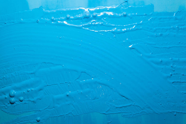 bright blue surface with paint strokes, background, texture - Photo, Image