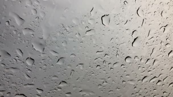 Water rain drops or steam shower on glass. Water droplets that increase the amount of movement - Footage, Video